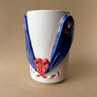 This is a multicolor tableware by Alexandra Dzh called unique handmade ceramic cup with an animal face in standard