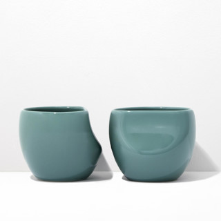 This is a green tableware by Powered By People called s/2 medium cup - jade in standard