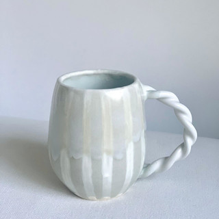 This is a white tableware by Cloude Made called frosted striped mug in standard
