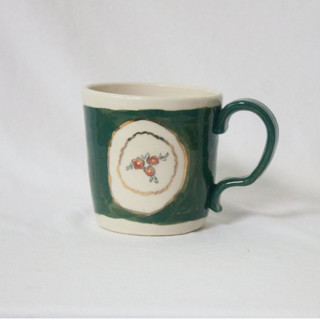 This is a green tableware by Erika Christine Ceramics called cornflower mug- emerald in standard