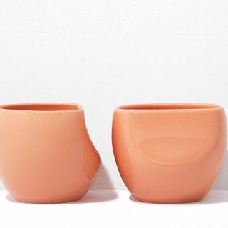 This is a brown tableware by Powered By People called fors studio s/2 medium cup - coral in standard