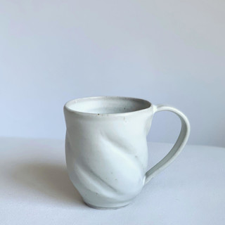 This is a white tableware by Cloude Made called white spiral mug in standard