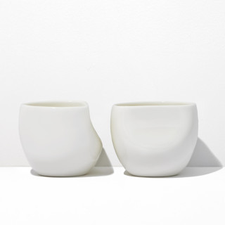This is a white tableware by Powered By People called s/2 medium ceramic cup - white in standard