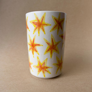 This is a multicolor tableware by Alexandra Dzh called unique handmade ceramic cup with stars in standard