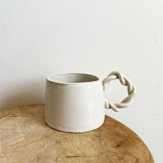 This is a white tableware by Sidney Field called braid handled mug in standard