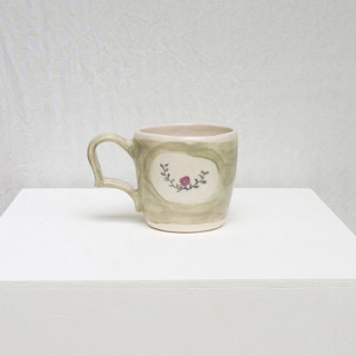 This is a green tableware by Erika Christine Ceramics called cornflower mug- mint in standard