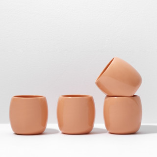 This is a orange tableware by Powered By People called s/4 small espresso cup - coral in standard