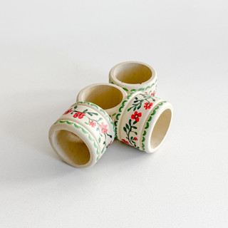 This is a multicolor tableware by Arohika Verma called hand painted napkin rings (set of 4) in standard