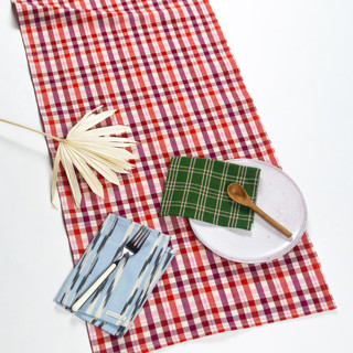 This is a red tableware by Archive New York called noel plaid handwoven cotton table runner in standard