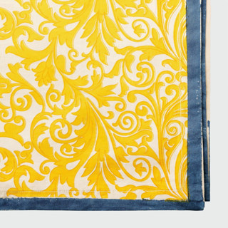 This is a yellow tableware by Joanna Buchanan called damask print tablecloth, yellow in standard
