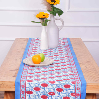 This is a red tableware by Michelle Pham called araminta blockprint tablerunner in standard