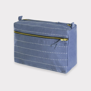 This is a blue custom bag by Anchal called Large Pin-Stitch Toiletry Bag - Slate in standard.