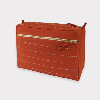 This is a red custom bag by Anchal called Large Pin-Stitch Toiletry Bag - Rust in standard.