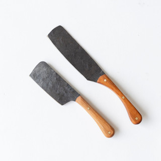 This is a natural tableware by Millstream Home called the small hand-forged knife in cherry in standard