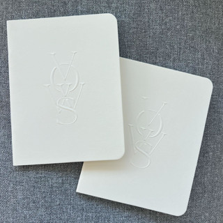 This is a natural vow books by Eva Tadros called luxe embossed unisex vow books, set of two light cream - blank paper in standard