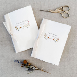 This is a beige vow books by Jen Simpson called floral boquet vow books - set of 2 in standard