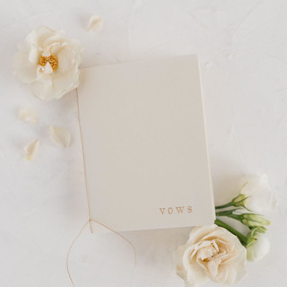This is a white vow books by Studio Lavender called ivory wedding vow books, set of two in standard