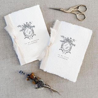 This is a gray vow books by Jen Simpson called ornate monogram crest vow book - set of 2 in standard