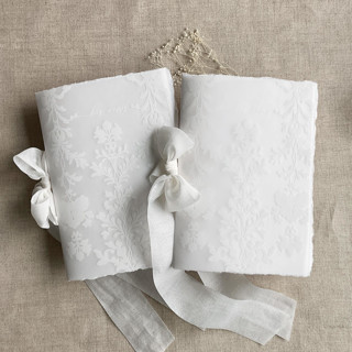 This is a white vow books by Ivory Invitations called elysea white vow book | set of 2 books | includes 1 her vows and 1 his vows in standard