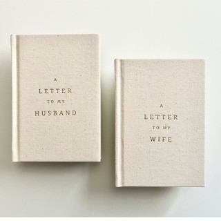This is a beige vow books by Carolyn Jung called a letter to my husband / wife linen vow books in standard