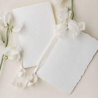 This is a white vow books by Studio Lavender called 'our vows' embossed wedding vow books, set of two in standard