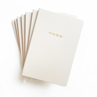 This is a beige vow books by Jessica Cunningham called linen wedding vows book | gold foil on cream linen in standard