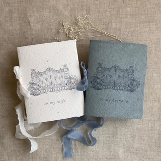 This is a blue vow books by Ivory Invitations called villa wedding vow books blue and cream | set of 2 books | includes 1 her vows and 1 his vows in standard
