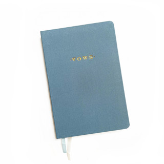 This is a blue vow books by Jessica Cunningham called linen wedding vow book | gold foil on dusty blue linen in standard