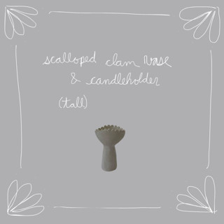 This is a white vases by Kristin Yezza called scalloped clam vase/ candleholder (tall) in standard