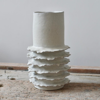 This is a white vases by OWO Cerámica called ribera tall coastal vase in standard