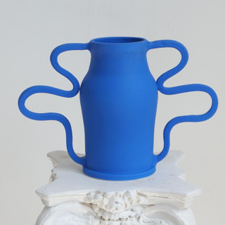 This is a blue vases by KuuPottery called curvy amphora matisse in standard