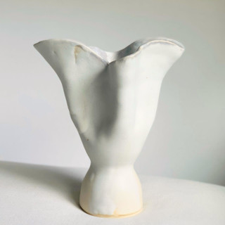 This is a white vases by Cloude Made called white tulip vase in standard