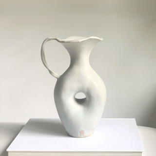 This is a white vases by Cloude Made called white lily vase in standard