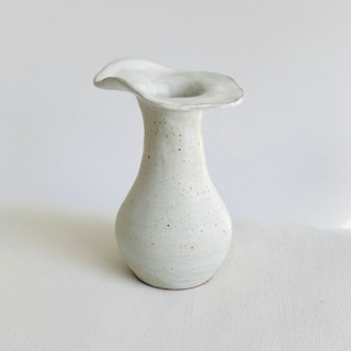 This is a white vases by Cloude Made called white petal vase in standard