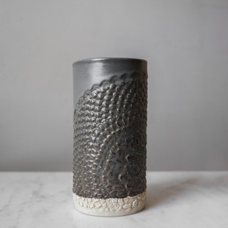 This is a gray vases by Handmade Studio TN called lace canister large - gunmetal in standard