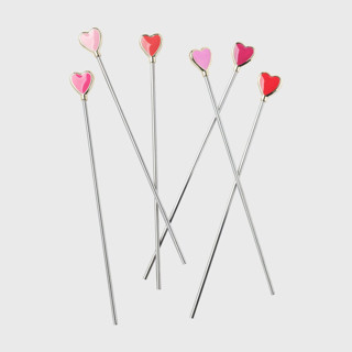 This is a pink tableware by Joanna Buchanan called heart swizzle sticks in standard