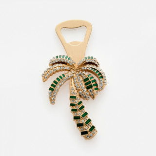 This is a gold tableware by Joanna Buchanan called palm tree bottle opener in standard