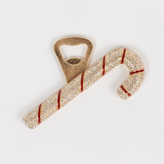 This is a brass tableware by Joanna Buchanan called candy cane bottle opener in standard