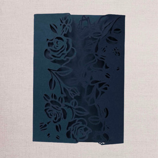 This is a beige vellum wedding invitations by Papel Custom Design called qty of 50 custom navy shimmer special asymmetric rose design laser cut | other color options available in standard