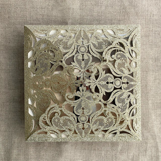 This is a gold vellum wedding invitations by Ivory Invitations called champagne gold glitter lace laser cut square petal fold | pack of 10 in standard