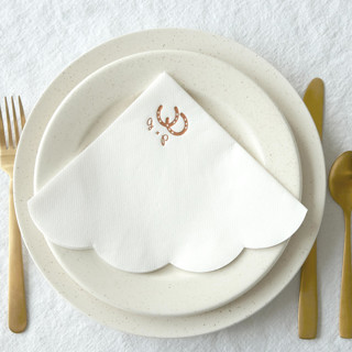 This is a white decorative paper napkins by ForYourParty called horseshoe initials scallop luncheon napkin in standard