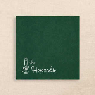 This is a green decorative paper napkins by Papel Custom Design called elegant green linen-like napkin with personalized family name & champagne glass icon | pack of 50 in standard