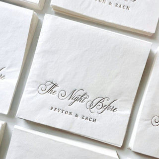 This is a white decorative paper napkins by Alyssa Cook called the night before cocktail napkins | custom rehearsal dinner decor | set of 50 in standard