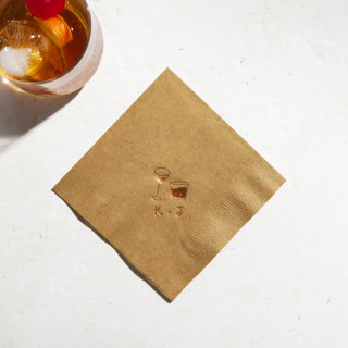 This is a bronze decorative paper napkins by ForYourParty called sip in style dual glass napkin, cocktail size, set of 50 in standard
