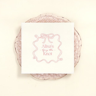This is a white decorative paper napkins by ForYourParty called ribbon frame tying the knot napkin, luncheon size, set of 100 in standard