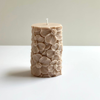 This is a beige wedding candles by Over By The Moon called beige floral pillar in standard