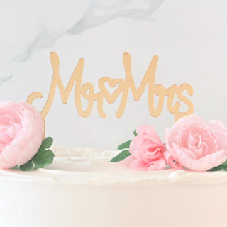 This is a gold wedding cake toppers by Em and Me Studio called mr & mrs cake topper, gold in standard
