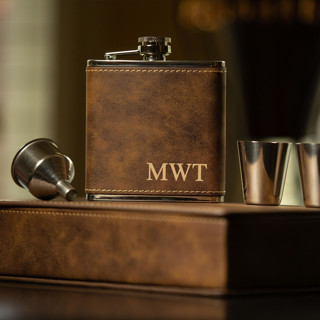 This is a brown groomsmen gifts by Great Little Favor Co called rustic brown custom engraved initials flask gift set in standard