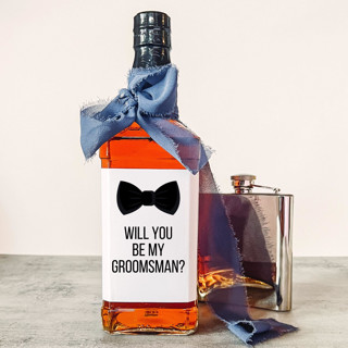 This is a white groomsmen gifts by The Pretty Little Mess called groomsman liquor bottle label | will you be my groomsman? in standard
