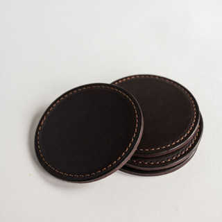 This is a brown groomsmen gifts by Millstream Home called the leather coasters in tobacco in standard